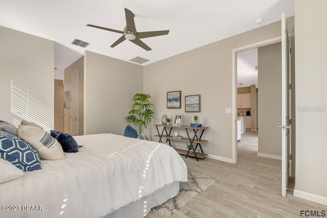 bedroom with light wood-type flooring and ceiling fan