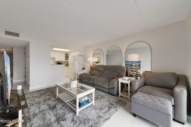 living room featuring light tile patterned flooring