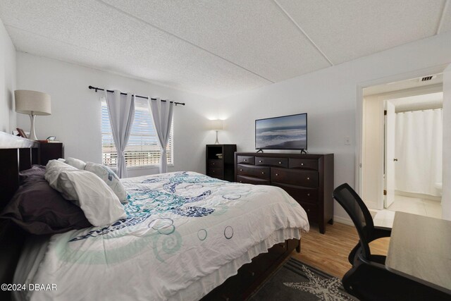 bedroom with hardwood / wood-style floors