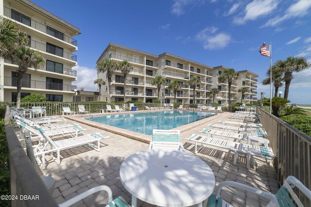 view of swimming pool with a patio