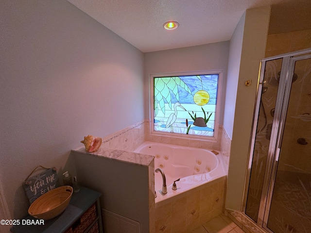 full bathroom with visible vents, a jetted tub, tile patterned flooring, a textured ceiling, and a shower stall