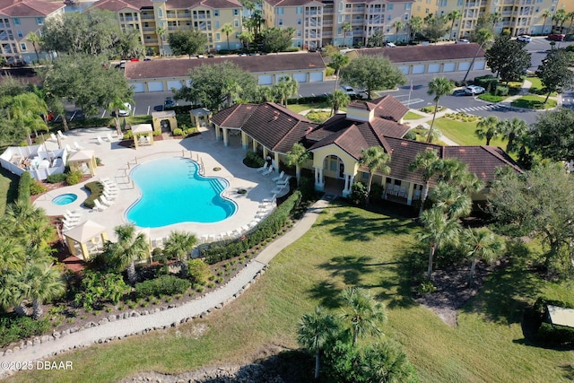 pool featuring a patio area and a yard