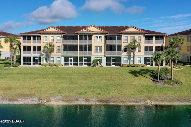 view of building exterior with a water view