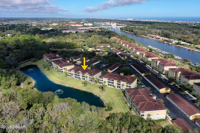 bird's eye view with a water view and a residential view