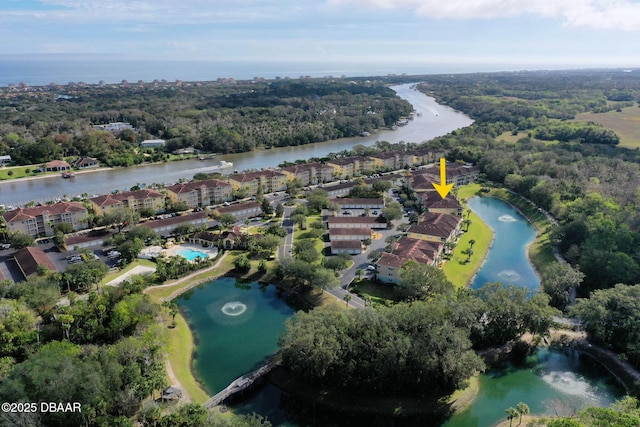 bird's eye view featuring a water view and a wooded view