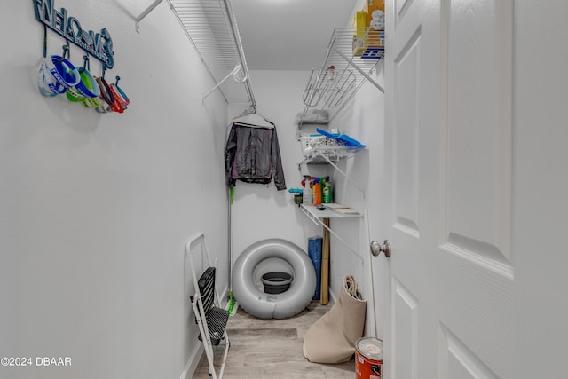 laundry room featuring wood-type flooring