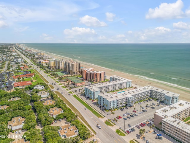 birds eye view of property featuring a view of the beach and a water view