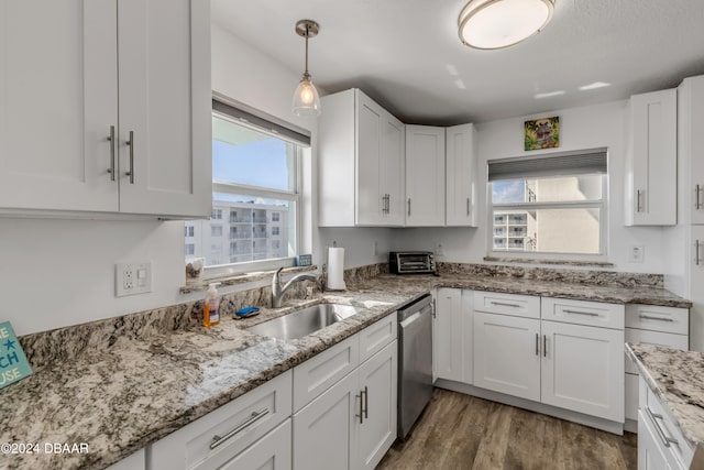 kitchen with white cabinetry and plenty of natural light