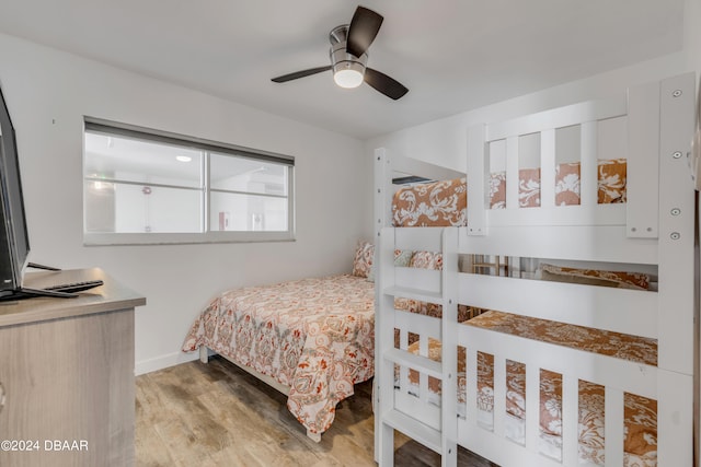 bedroom with ceiling fan and light hardwood / wood-style floors