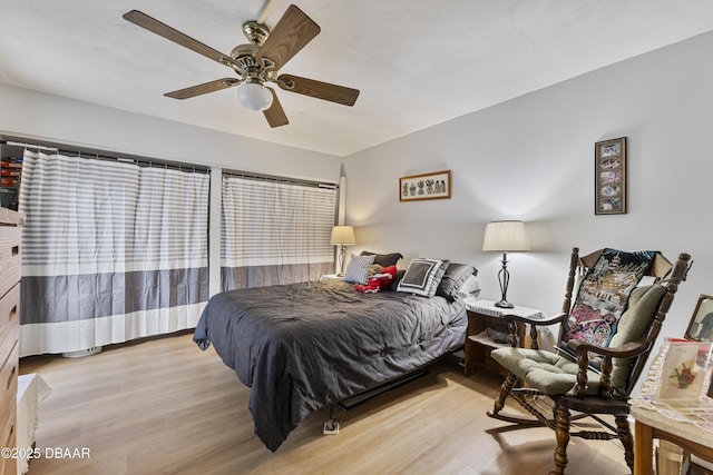 bedroom featuring ceiling fan and wood finished floors