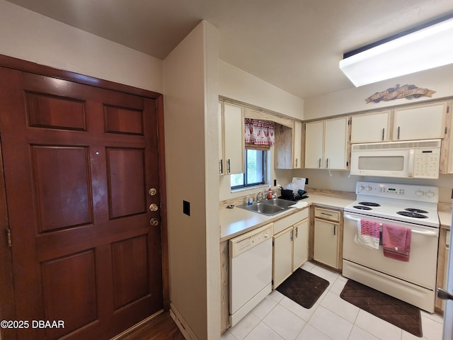 3557 Forest Branch Dr Unit B, Port Orange, FL 32129 - kitchen featuring white appliances, light countertops, cream cabinets, and light tile patterned flooring