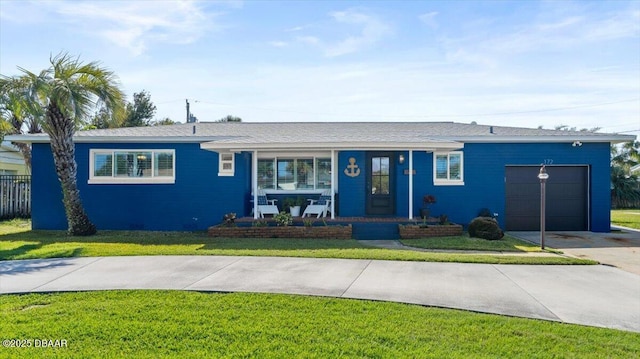 ranch-style house with driveway, an attached garage, covered porch, fence, and a front lawn