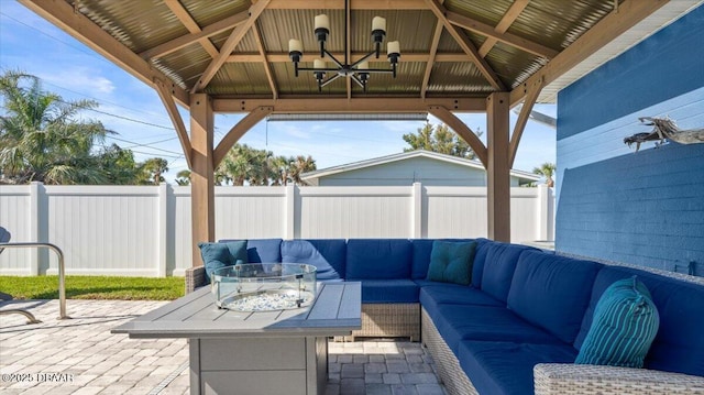 view of patio featuring an outdoor hangout area, a gazebo, and a fenced backyard