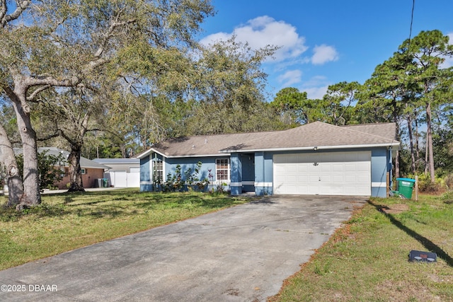 ranch-style home featuring an attached garage, driveway, and a front lawn