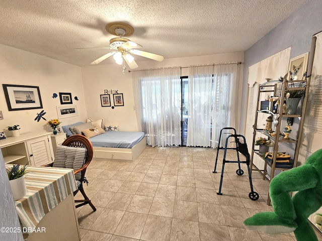 bedroom featuring a textured ceiling and ceiling fan