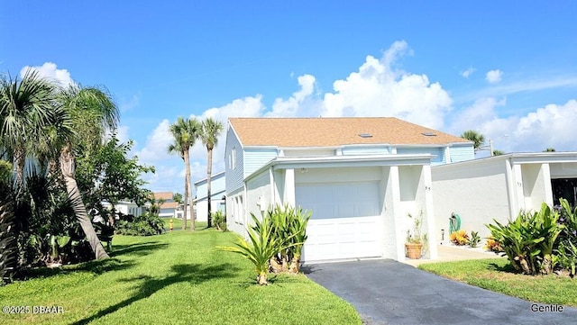 55 Chippingwood Ln, Ormond Beach, FL 32176 - view of front of property with a front lawn, driveway, a garage, and stucco siding