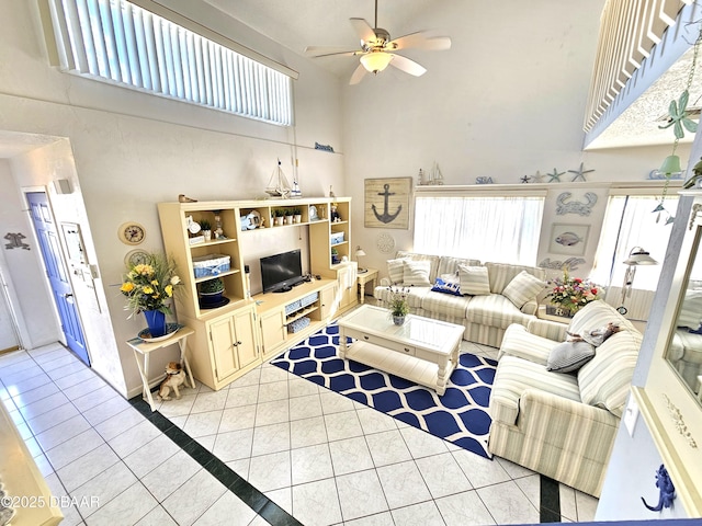 55 Chippingwood Ln, Ormond Beach, FL 32176 - living room featuring a towering ceiling, light tile patterned floors, and ceiling fan