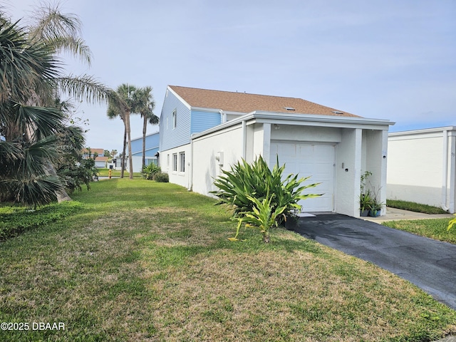 view of side of home featuring a yard and a garage