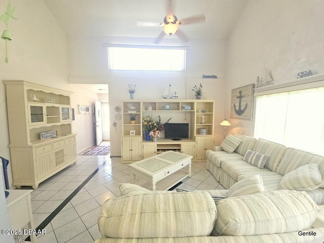 55 Chippingwood Ln, Ormond Beach, FL 32176 - living room with light tile patterned floors, a ceiling fan, and a high ceiling