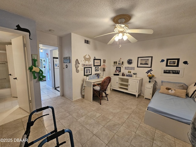 office with ceiling fan, light tile patterned floors, and a textured ceiling