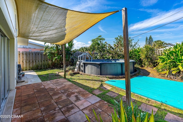 view of patio featuring a fenced in pool