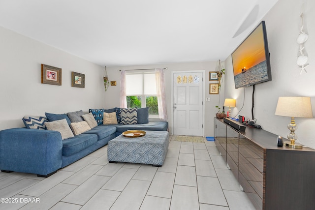 living room with light tile patterned flooring