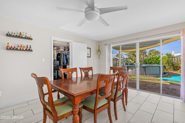 dining area featuring light tile patterned floors and ceiling fan