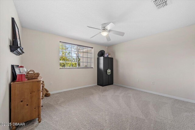 21 Whittingham Ln, Palm Coast, FL 32164 - interior space featuring carpet floors, a ceiling fan, visible vents, and baseboards