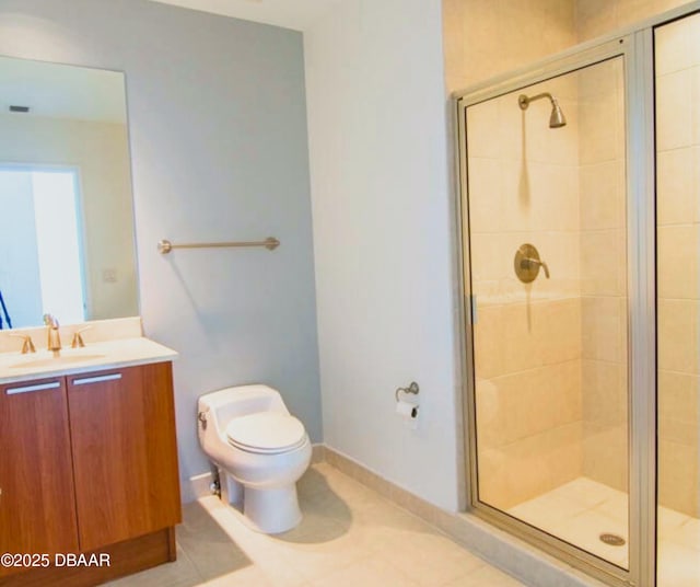 bathroom featuring toilet, a stall shower, tile patterned flooring, and vanity