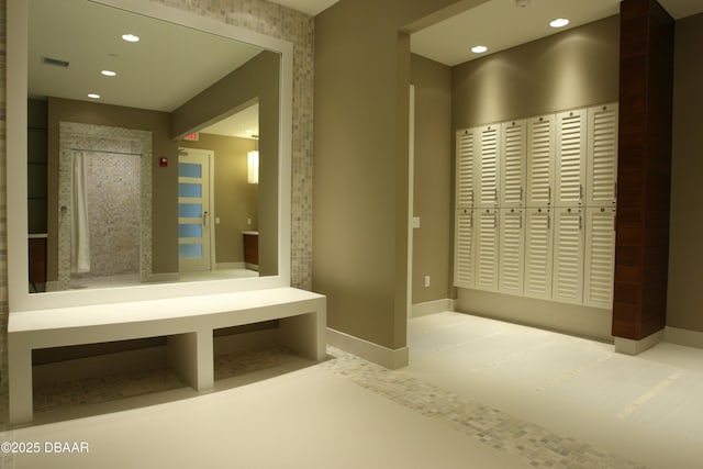 mudroom with baseboards and recessed lighting