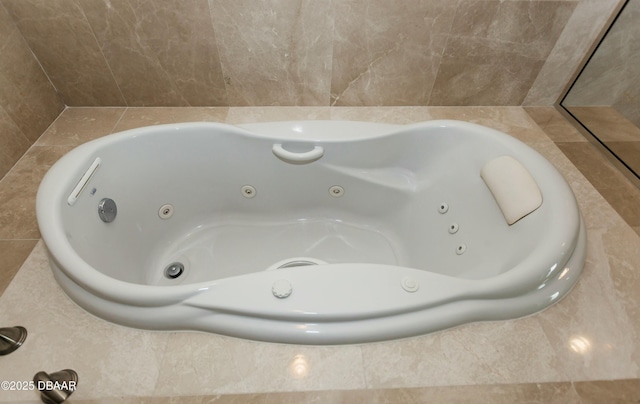 full bathroom featuring a whirlpool tub