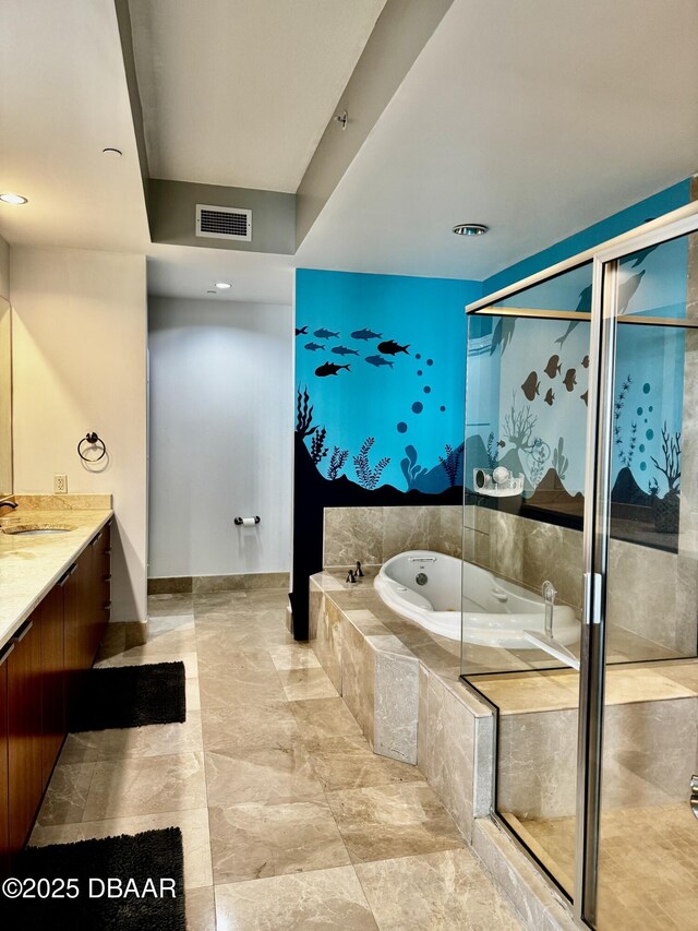 clothes washing area with stacked washer and dryer and laundry area