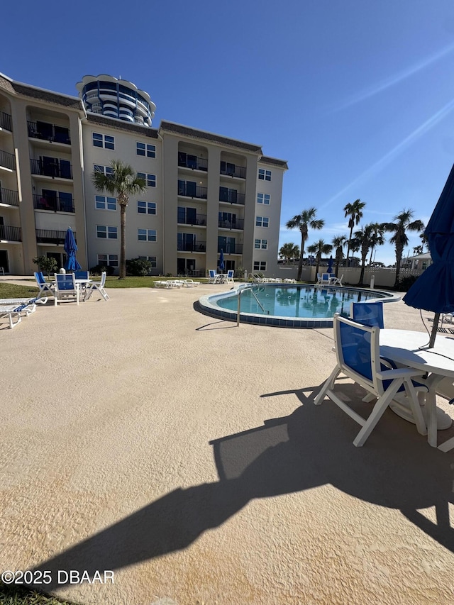 view of swimming pool featuring a patio