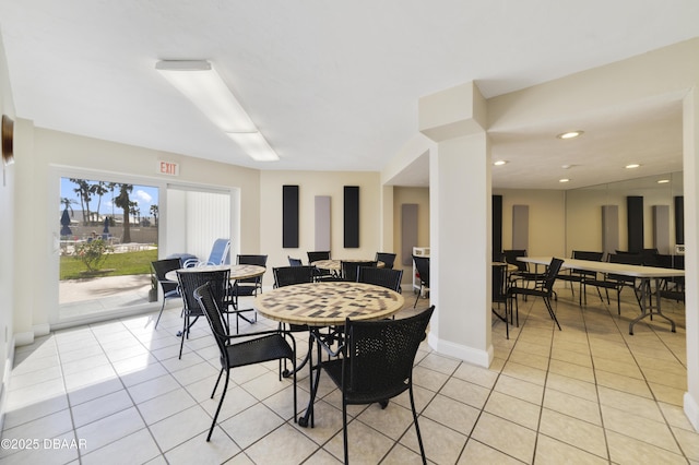 dining space featuring recessed lighting, baseboards, and light tile patterned flooring