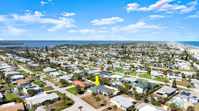 bird's eye view featuring a water view and a residential view