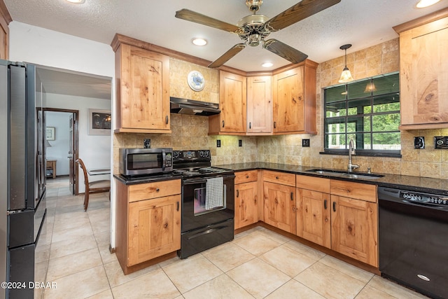 kitchen featuring black appliances, sink, ceiling fan, decorative light fixtures, and extractor fan