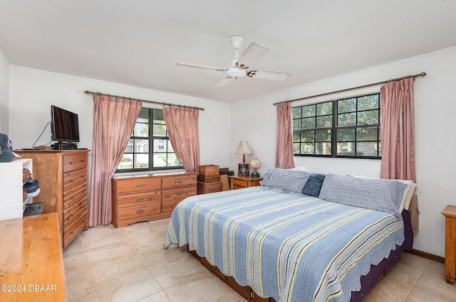 tiled bedroom with ceiling fan