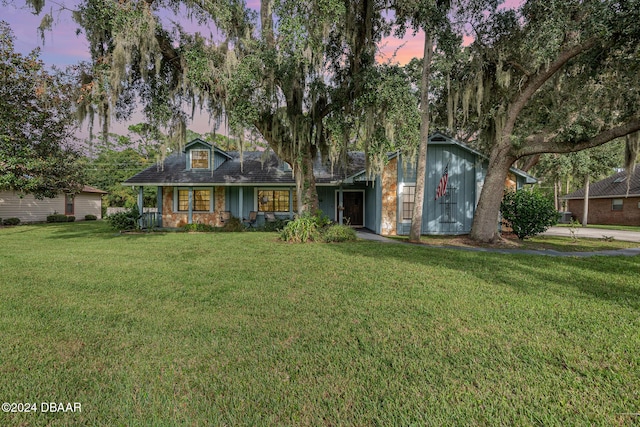 view of front of house with a lawn