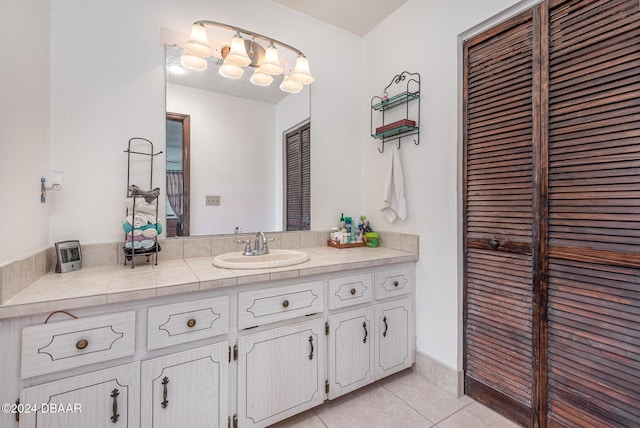 bathroom featuring tile patterned flooring and vanity