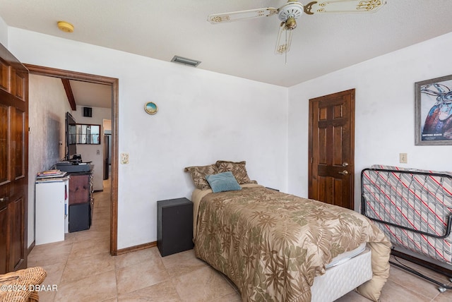 bedroom with ceiling fan and light tile patterned floors