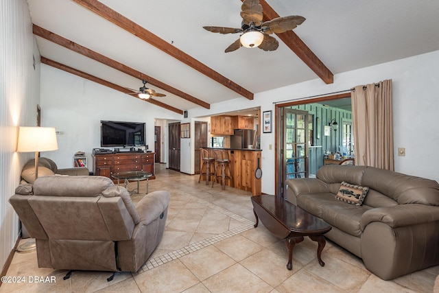 living room with vaulted ceiling with beams, ceiling fan, and light tile patterned flooring