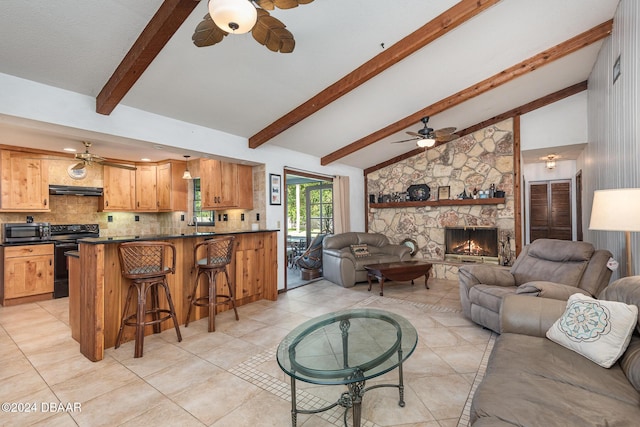 living room with a fireplace, beam ceiling, and high vaulted ceiling