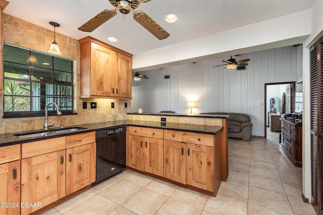 kitchen with dishwasher, sink, hanging light fixtures, light tile patterned floors, and kitchen peninsula