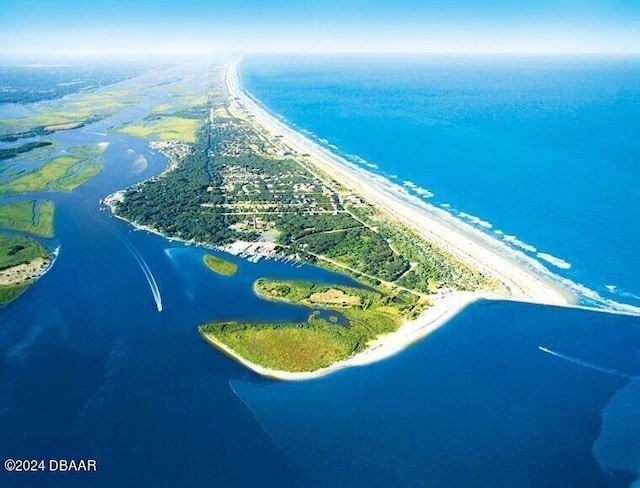 aerial view featuring a beach view and a water view