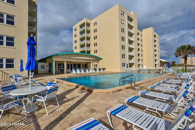 view of swimming pool featuring a patio