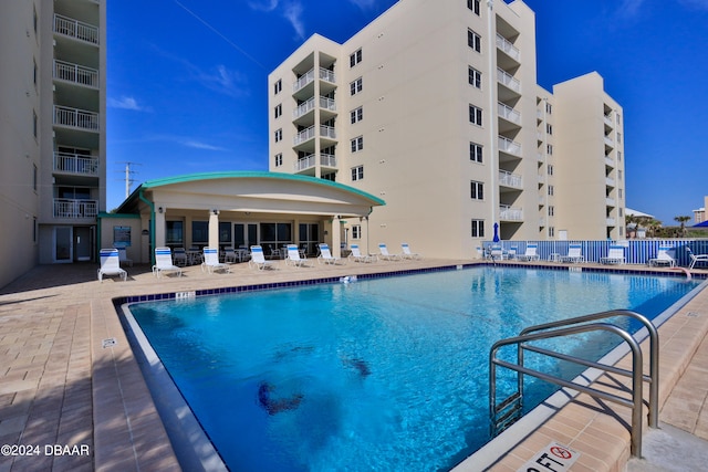 view of swimming pool featuring a patio