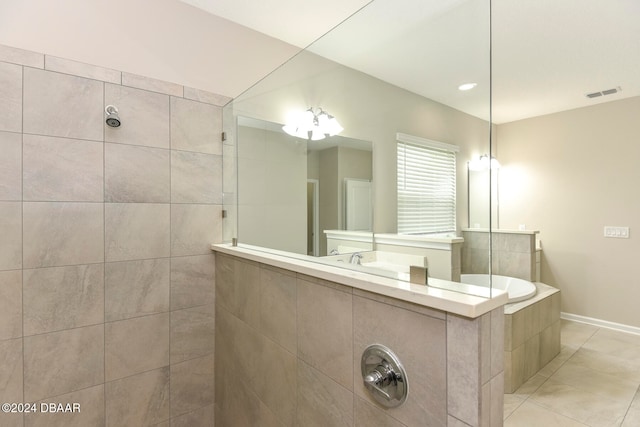 bathroom with tile patterned floors and tiled shower