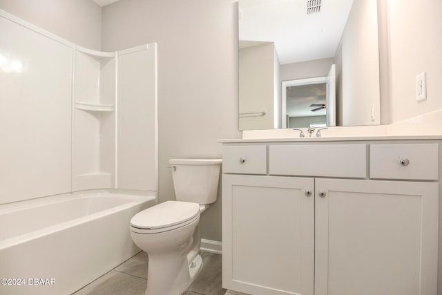 full bathroom with tile patterned floors, vanity, toilet, and washtub / shower combination