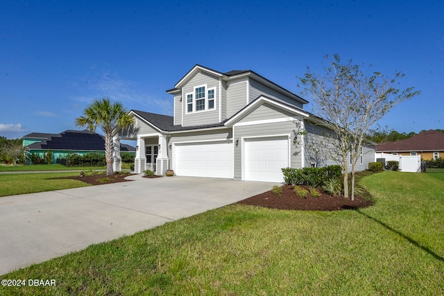 view of front facade featuring a front yard and a garage