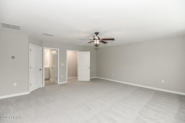 tiled empty room featuring ceiling fan and a healthy amount of sunlight